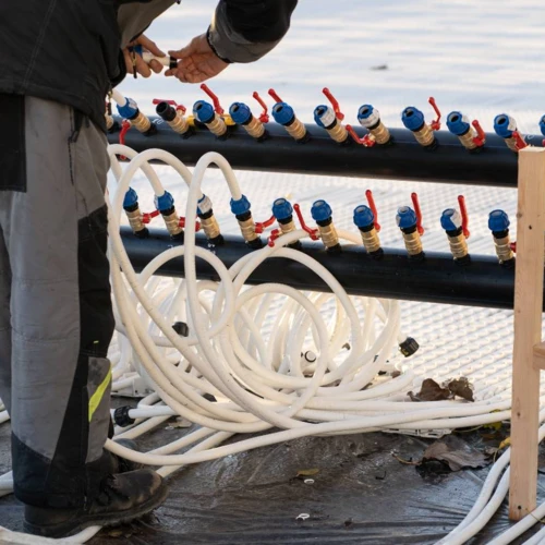worker-adjust-pipes-of-water