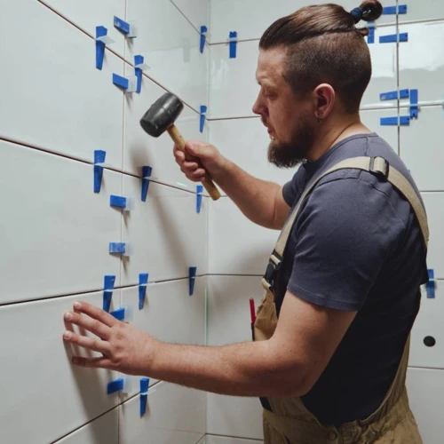 tiler-knocks-the-wedges